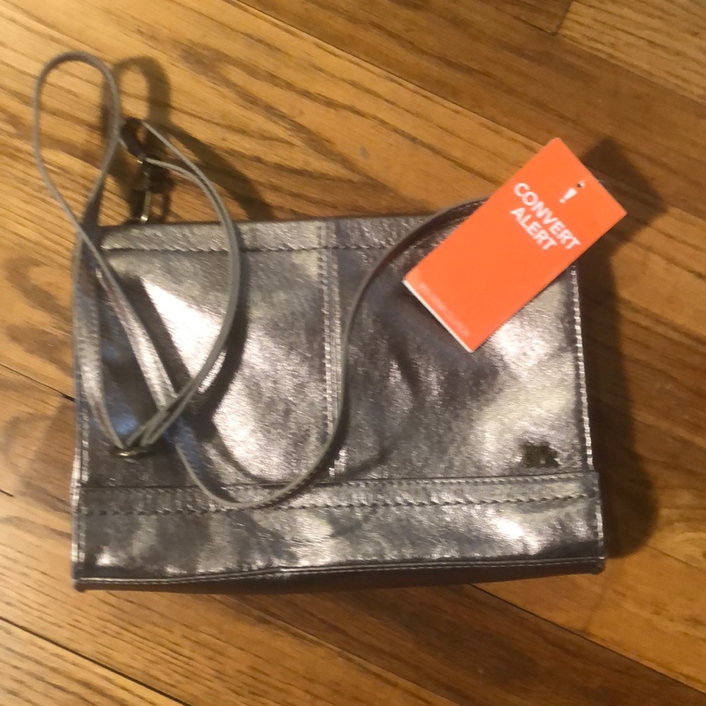 The dark leather adjustable clutch